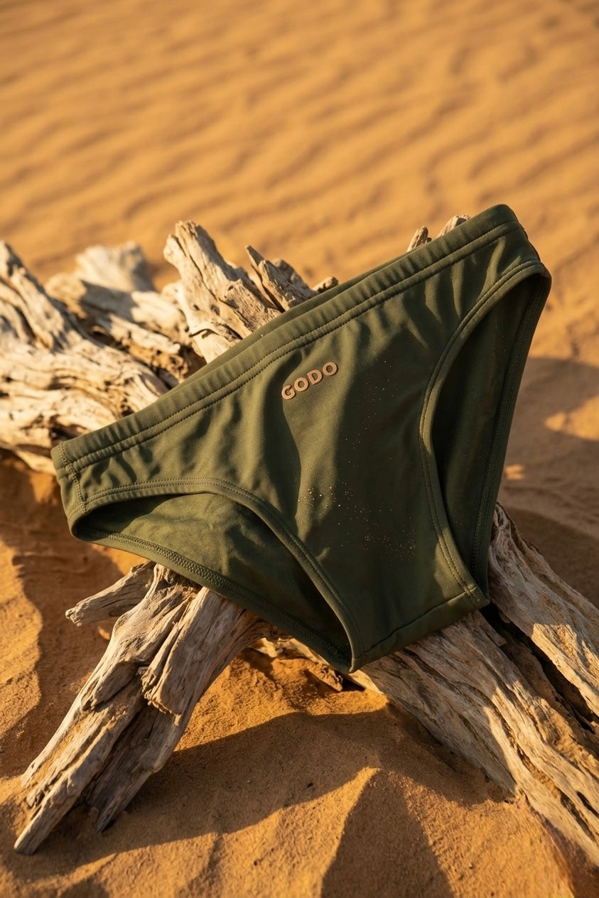 Men's olive green swim brief by GODO — minimal body-enhancing swimwear