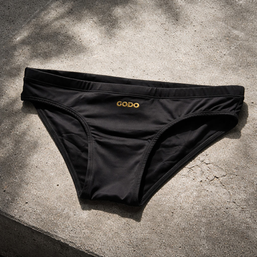 Men's classic black swim brief by GODO — minimal body-enhancing swimwear
