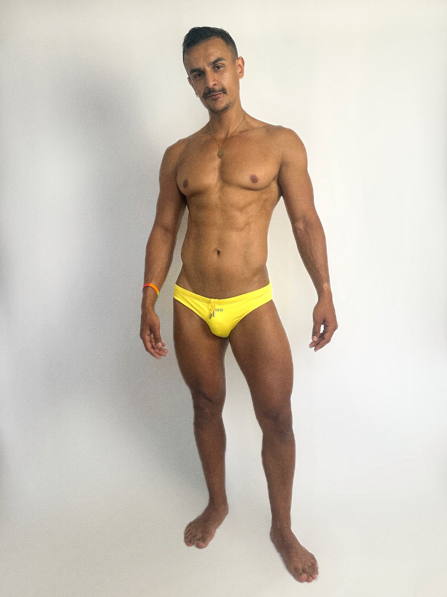 Arab guy in yellow swimsuit